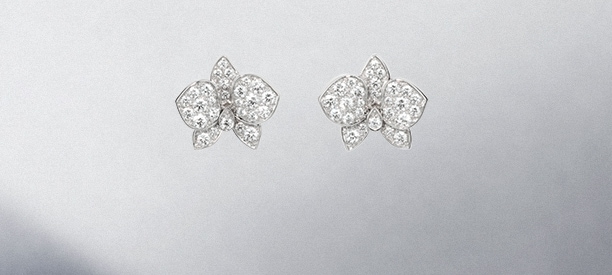 cartier single diamond earrings