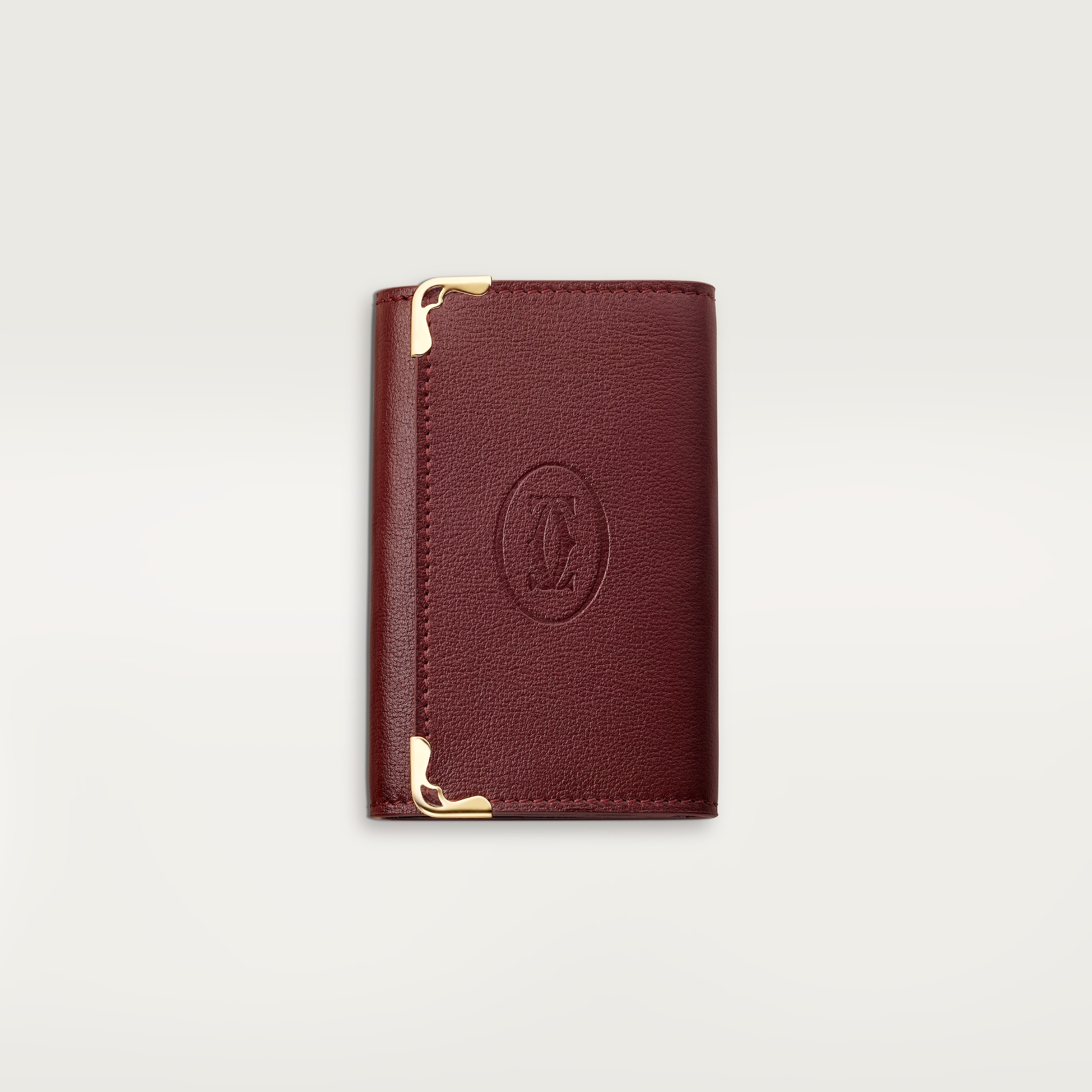 Must de Cartier 鑰匙圈，可掛6副鎖匙酒紅色小牛皮，金色飾面