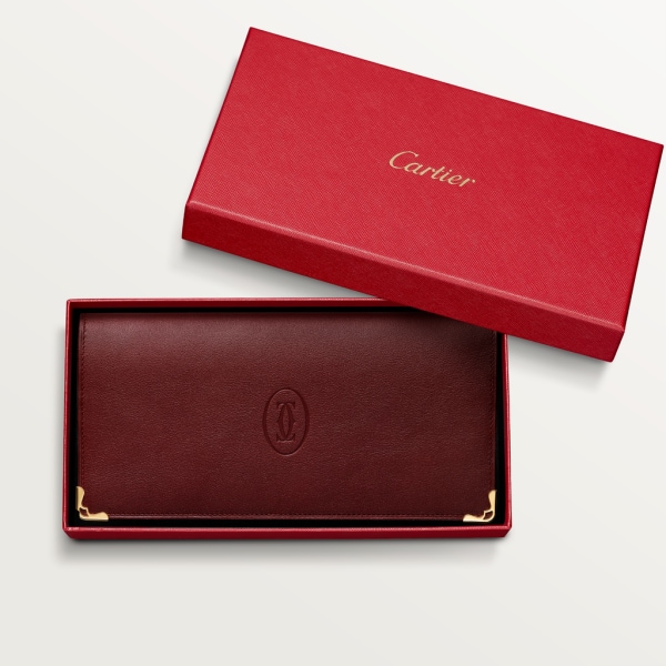 International Wallet with Gussets, Must de Cartier Burgundy calfskin, golden finish