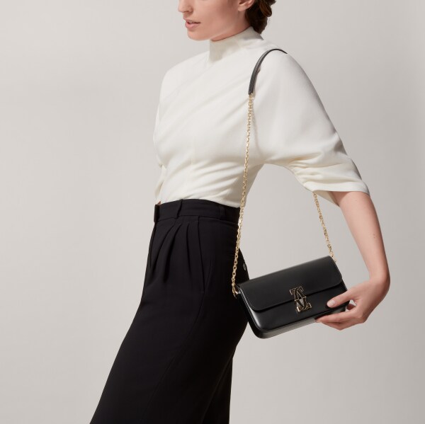 手袋，迷你款，C de Cartier 黑色小牛皮，金色及黑色琺瑯飾面