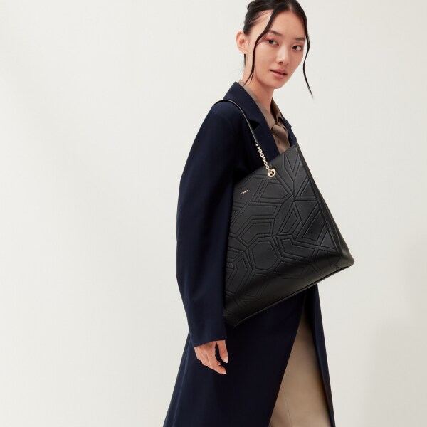 手提袋，Panthère 黑色粒面小牛皮，金色飾面