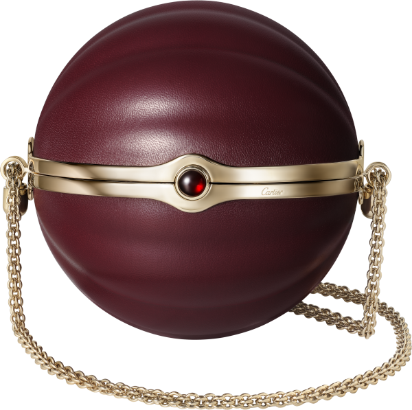 Round bag with gadroon motif, Cartier Soir Burgundy lambskin, hessonite garnet and golden finish