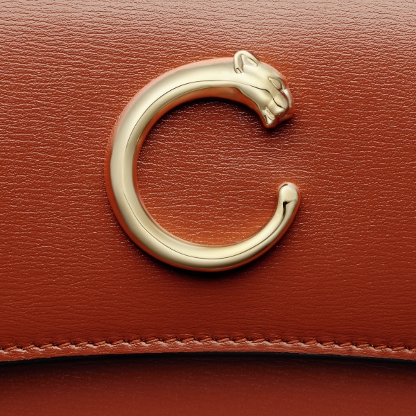 International wallet with flap, Panthère de Cartier
 Chestnut calfskin, golden finish